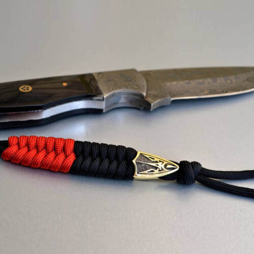 Фото темляк с тризубом